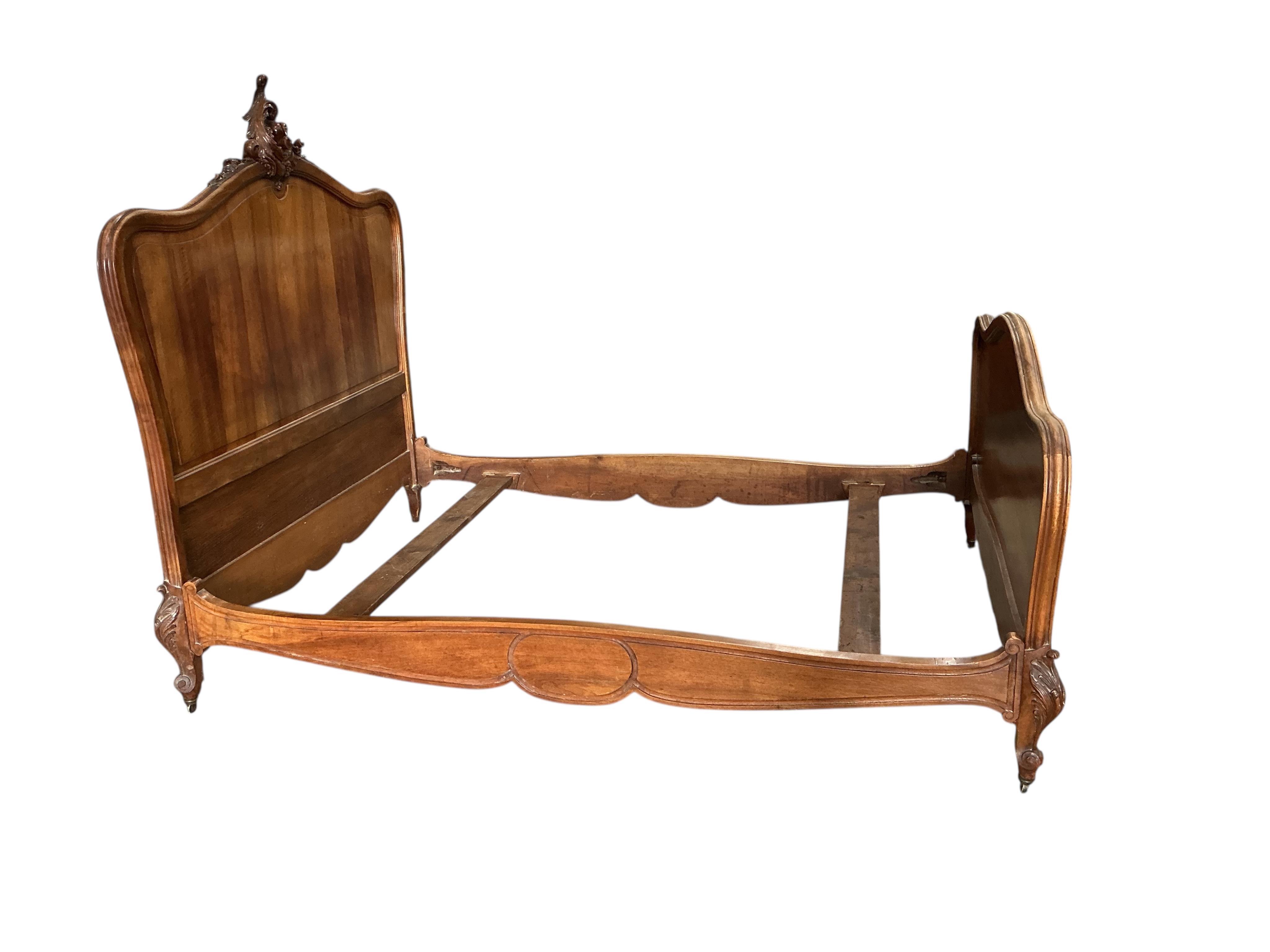 An early 20th century French walnut double bed frame, width 150cm, length 205cm, height 153cm
